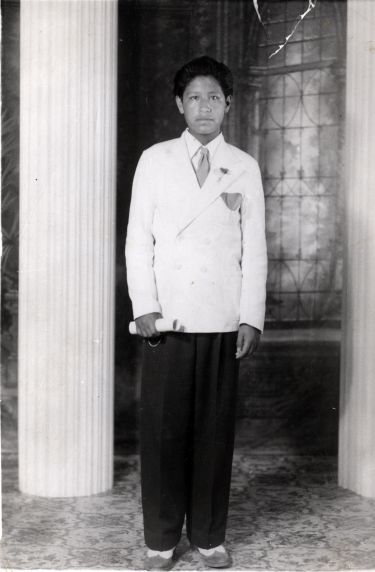Portrait of Cesar Chavez taken at his 8th grade graduation, 1942. This was his final year of formal schooling before he went to work in the fields full time.